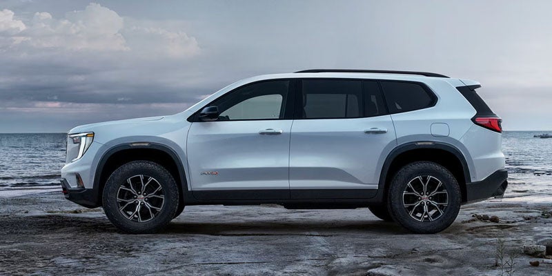 White 2026 GMC Acadia side view.